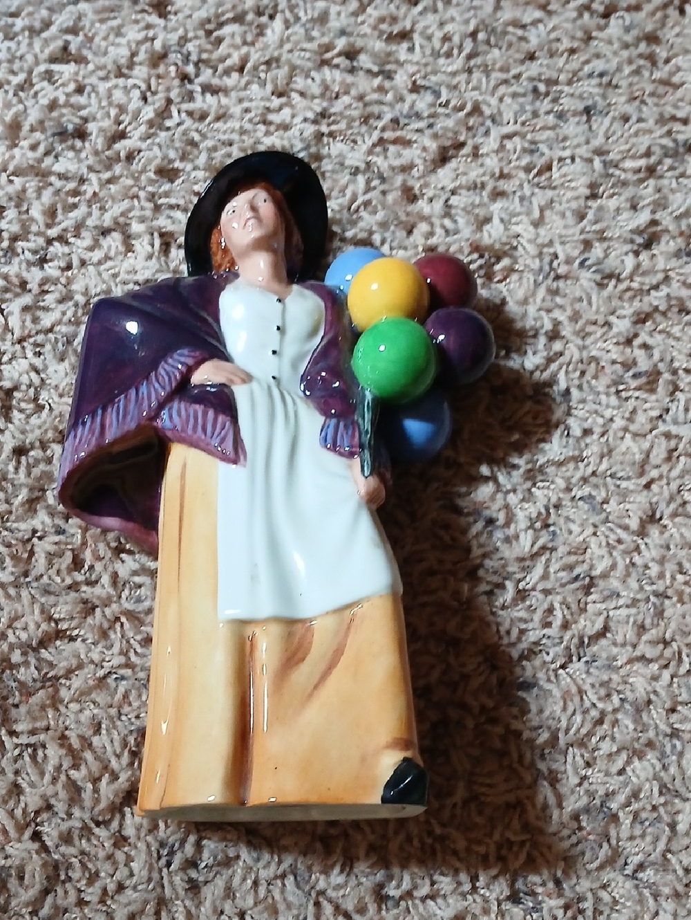 Royal Doulton Figurine with Purple Coat and Multicolor Balloons
